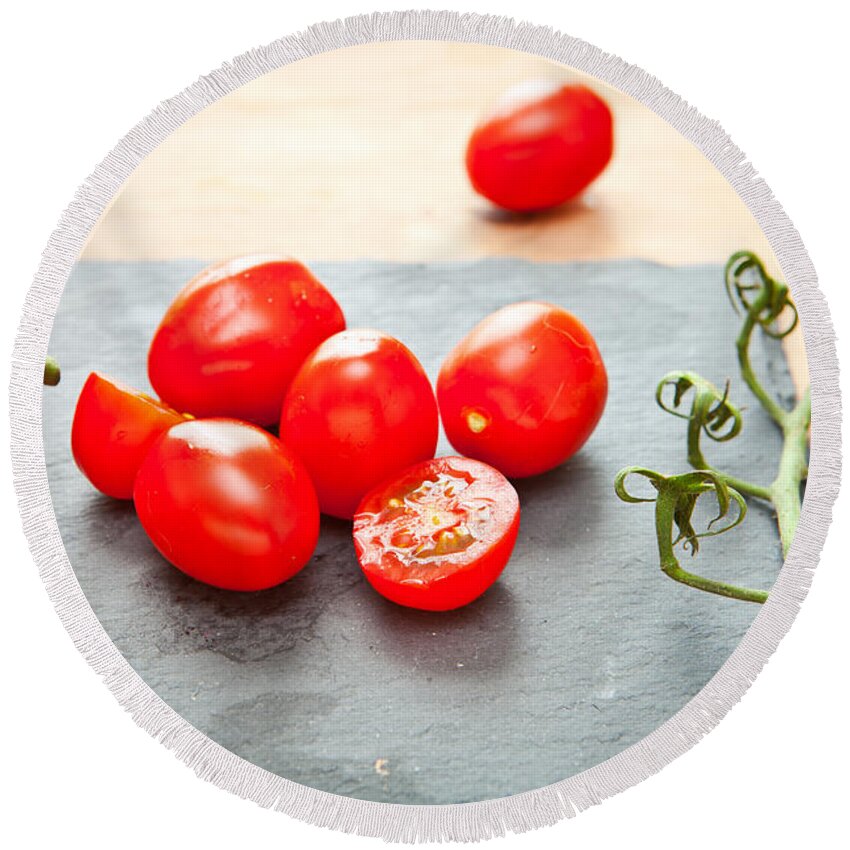 Cherry Round Beach Towel featuring the photograph Cherry tomatoes by Tom Gowanlock