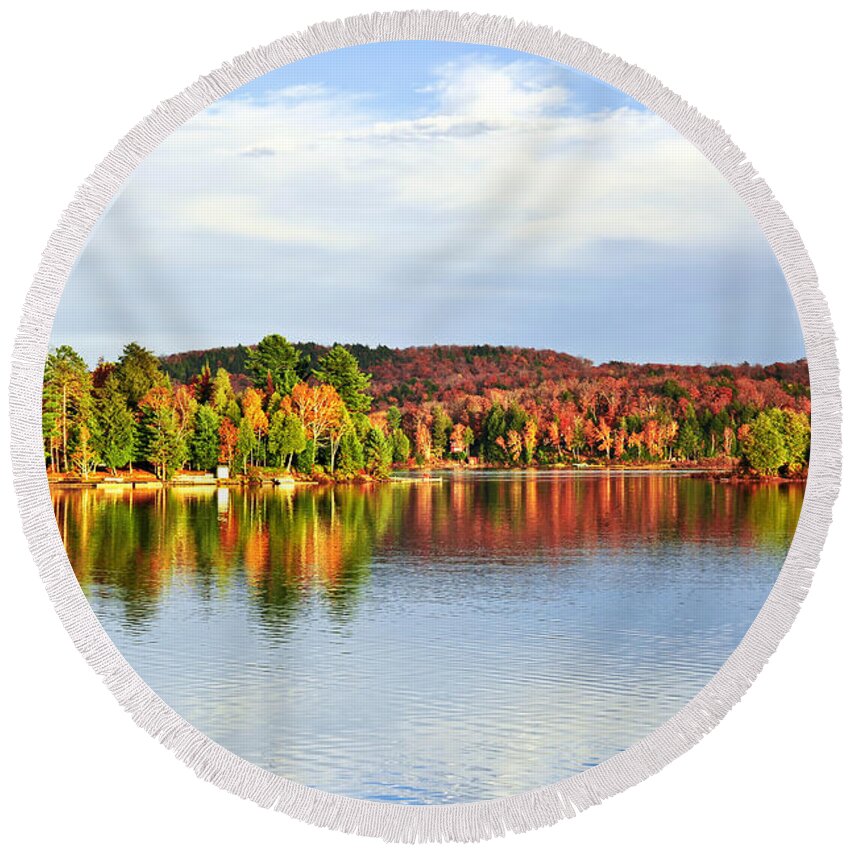 Lake Round Beach Towel featuring the photograph Fall forest reflecting in lake by Elena Elisseeva