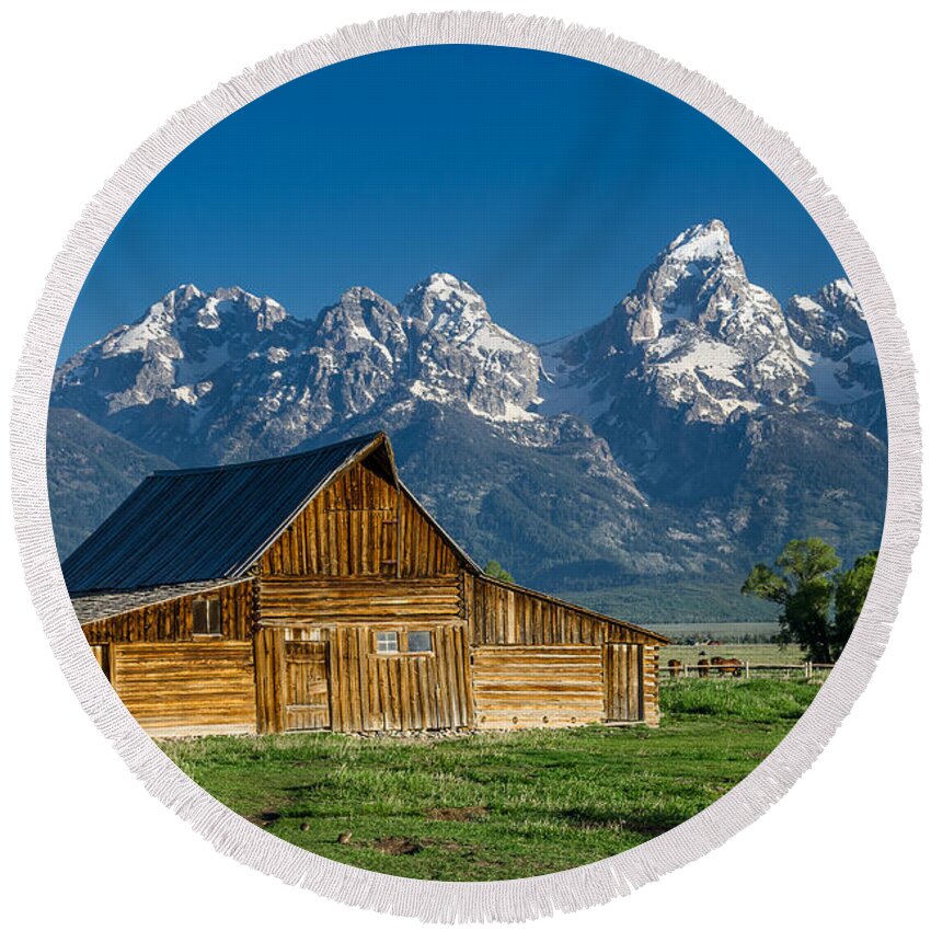 Mormon Row Round Beach Towel featuring the photograph Molton Barn and Grand Tetons by Greg Nyquist