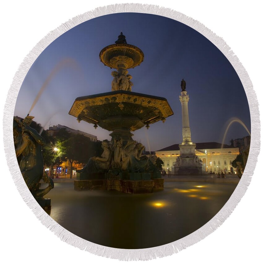 Rossio Square Fountain Round Beach Towel featuring the photograph One of the fountains in Rossio Square at dusk by Sven Brogren