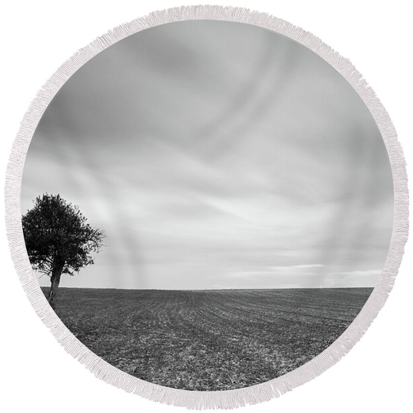 Olive Tree Round Beach Towel featuring the photograph Lonely Olive tree with moving clouds #1 by Michalakis Ppalis