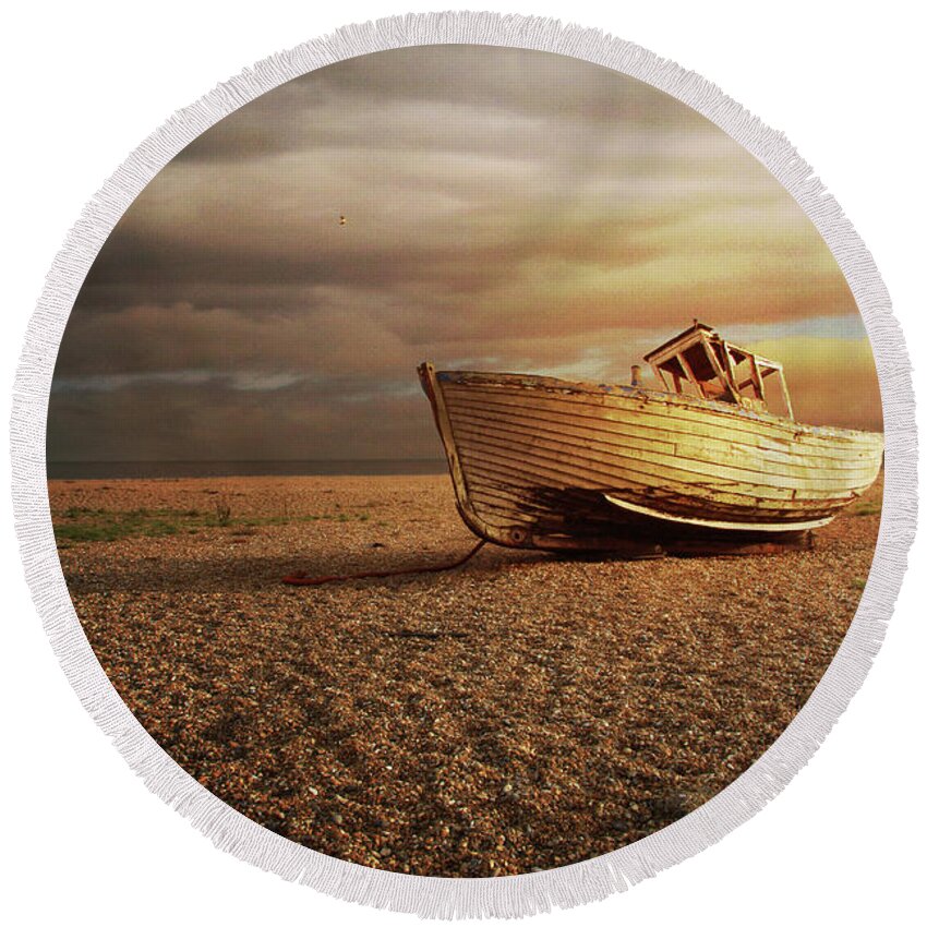 Fishing Boat Round Beach Towel featuring the photograph Old Wooden Boat Washed Up On A Beach by Ethiriel Photography