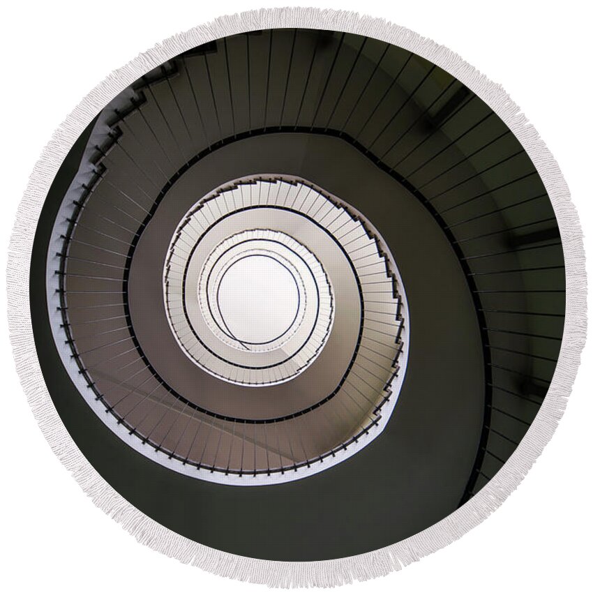 Spiral Staircase Round Beach Towel featuring the photograph Spiral staircase in brown tones #1 by Jaroslaw Blaminsky