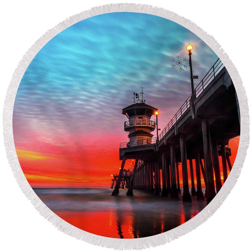 Ruby’s Round Beach Towel featuring the photograph Sunset at Huntington Beach Pier #1 by Peter Dang