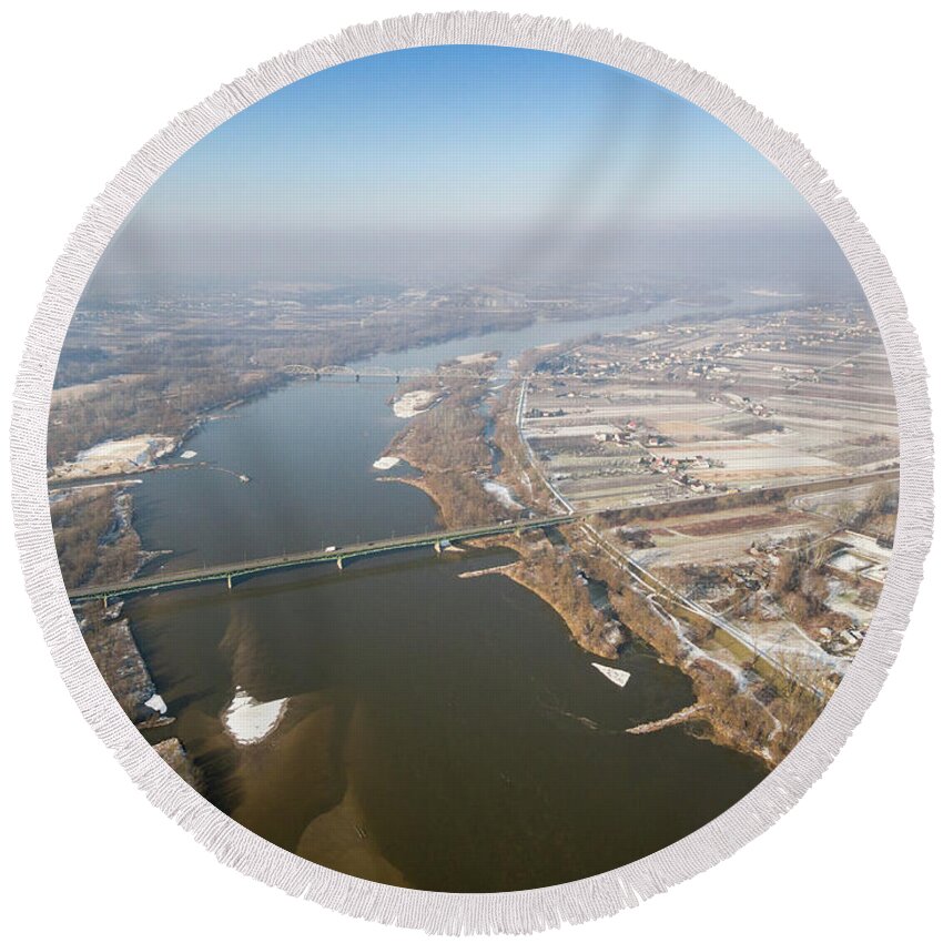Drone Round Beach Towel featuring the photograph A bird's eye view of a road bridge and a railway bridge across the river by Lukasz Szczepanski