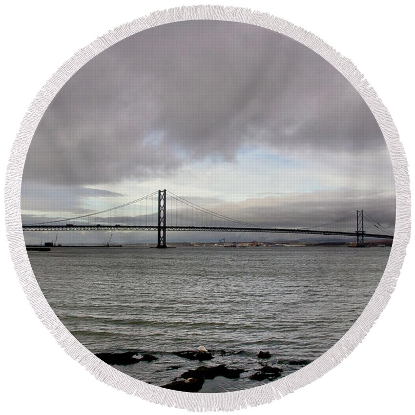 Daub Round Beach Towel featuring the photograph A daub of blue in the storm clouds over the Firth of Forth by Elena Perelman