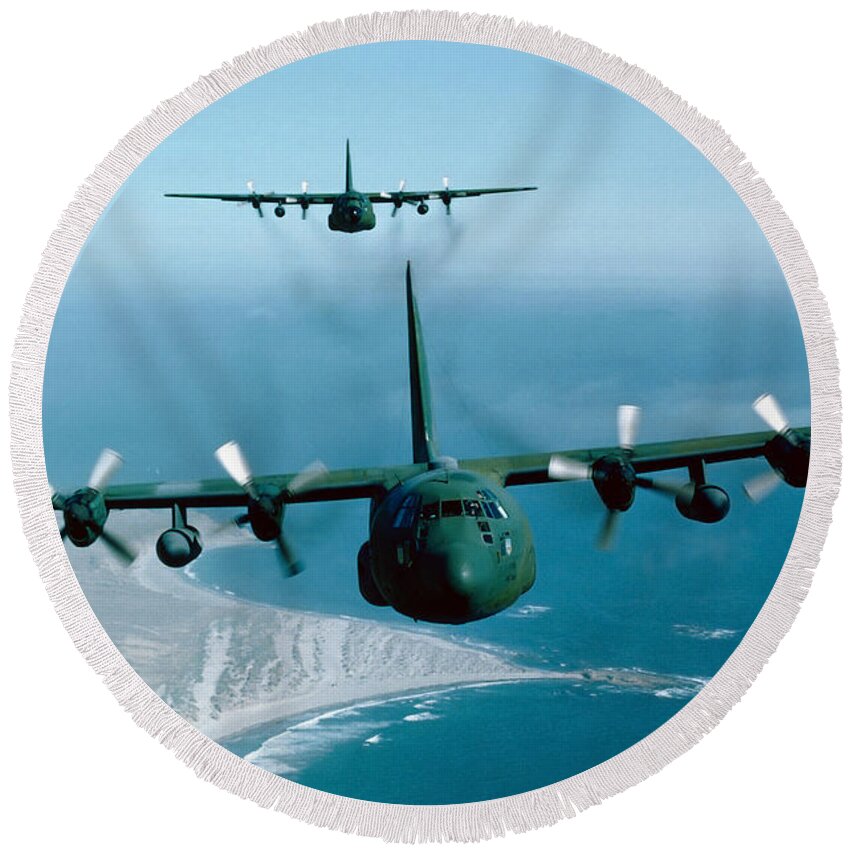 Horizontal Round Beach Towel featuring the photograph A Pair Of C-130 Hercules In Flight by Stocktrek Images