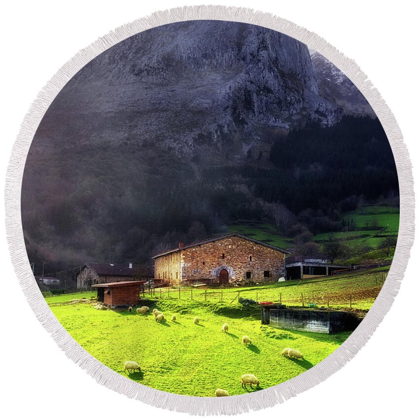 House Round Beach Towel featuring the photograph A typical basque country farmhouse with sheep by Mikel Martinez de Osaba