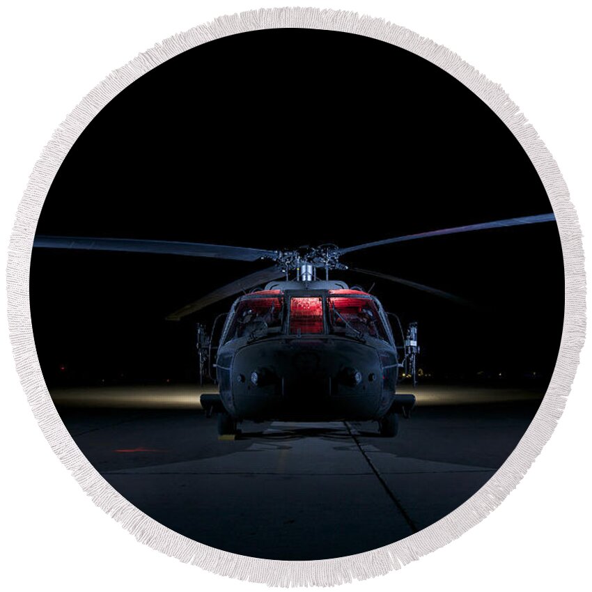 Operation Iraqi Freedom Round Beach Towel featuring the photograph A Uh-60 Black Hawk Helicopter Lit by Terry Moore