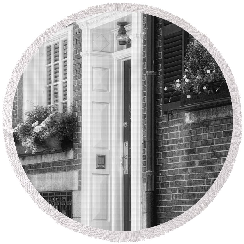 Acorn Street Round Beach Towel featuring the photograph Acorn Street Door And Windows BW by Susan Candelario