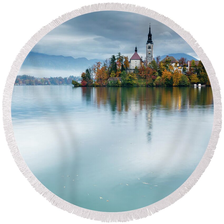 Bled Round Beach Towel featuring the photograph Autumn colours at Lake Bled by Ian Middleton