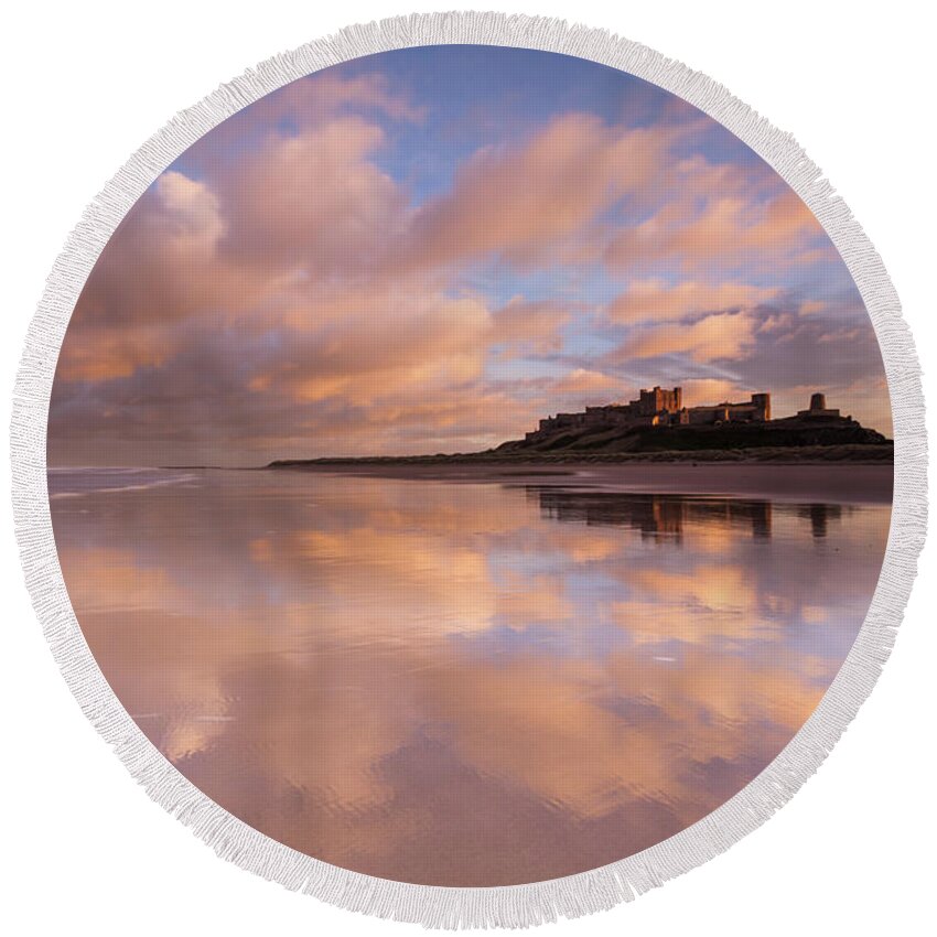 Bamburgh Castle Round Beach Towel featuring the photograph Bamburgh Castle sunset reflections on the beach by Anita Nicholson