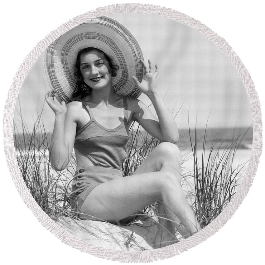 1920s Round Beach Towel featuring the photograph Bather In Straw Hat, C. 1930 by H Armstrong Roberts and ClassicStock