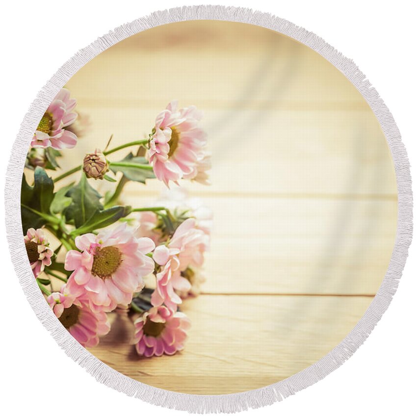 Flowers Round Beach Towel featuring the photograph Bouquet of fresh spring flowers on rustic wood by Michal Bednarek