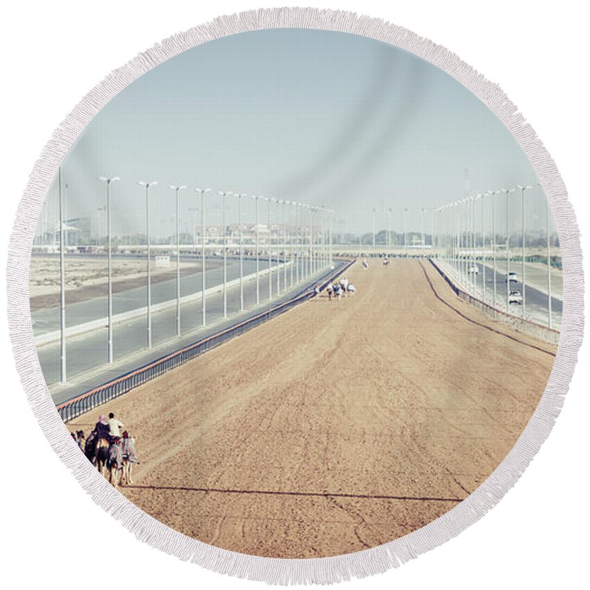 Al Marmoom Round Beach Towel featuring the photograph Camel racing track in Dubai by Alexey Stiop