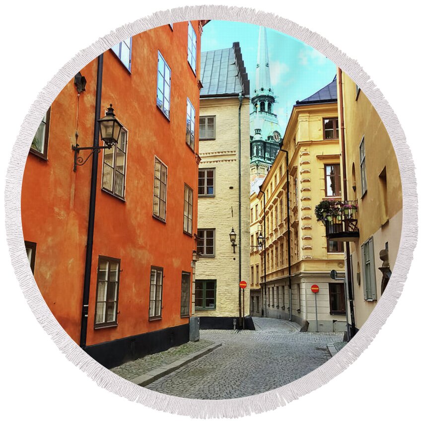 Stockholm Round Beach Towel featuring the photograph Colorful buildings in the old center of Stockholm by GoodMood Art