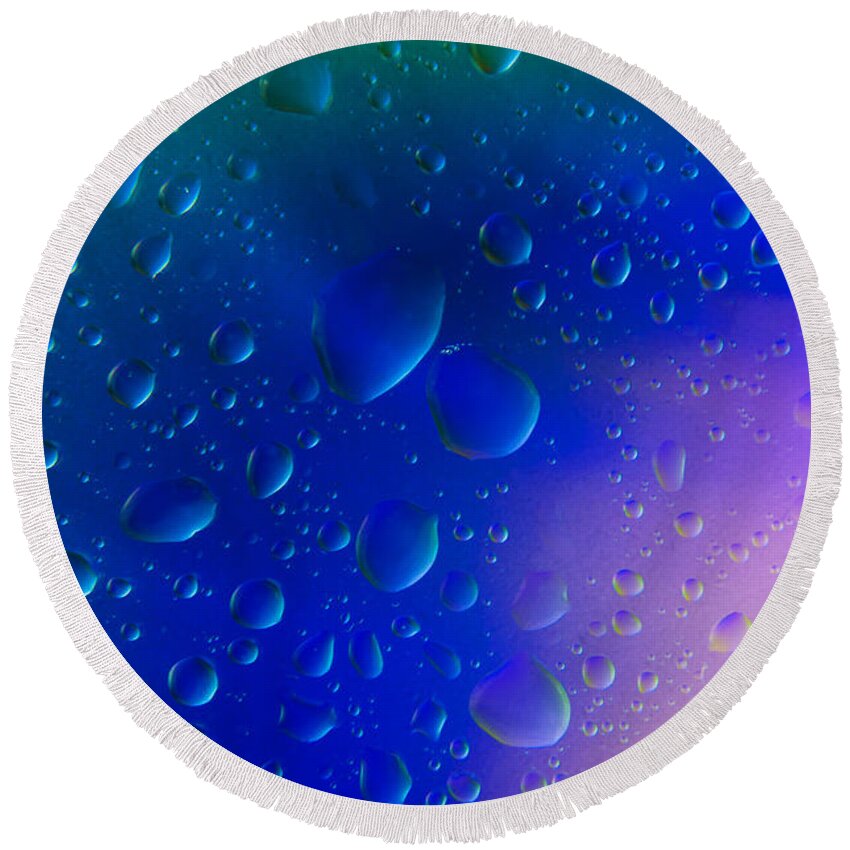 Abstract Round Beach Towel featuring the photograph Colorfull Water drop background abstract by Michalakis Ppalis