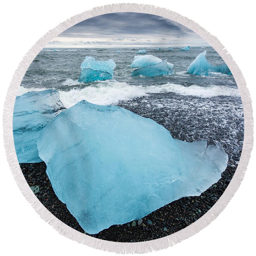 Iceland Round Beach Towel featuring the photograph Cool blue glacier ice on black beach in Iceland by Matthias Hauser