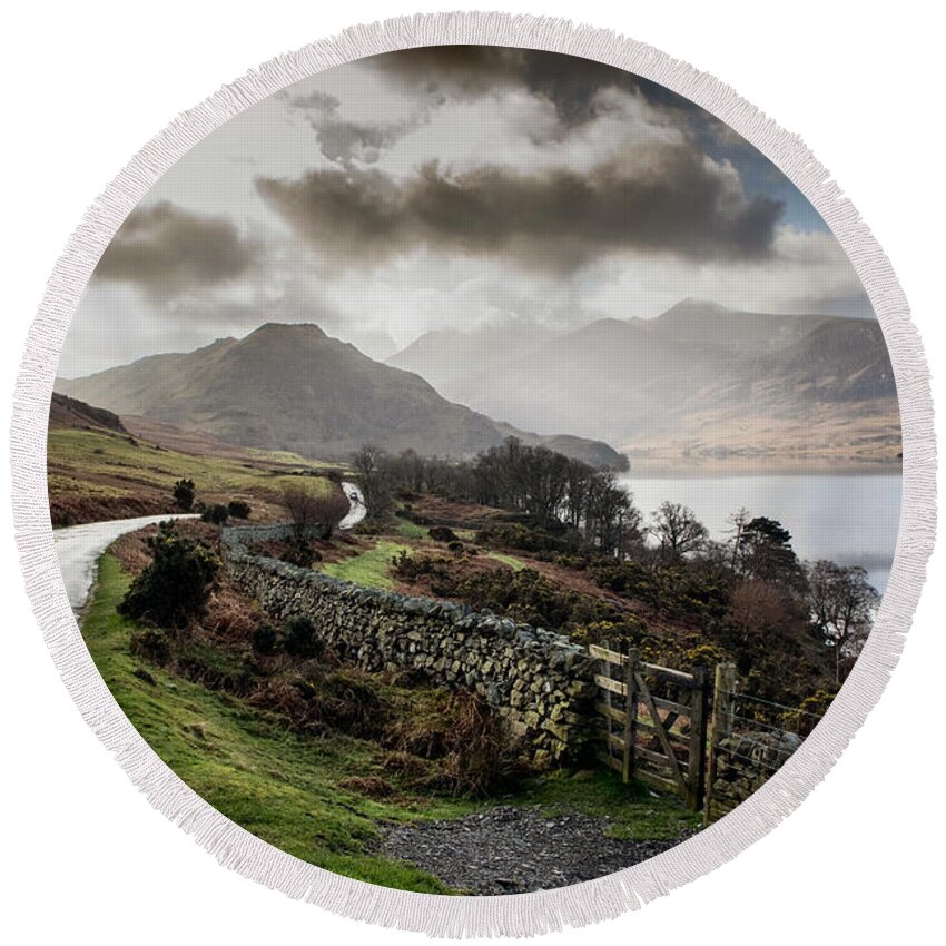 Road - Wall - Lake - Trees - Sky - Mountains Round Beach Towel featuring the photograph Cumnock Water by Chris Horsnell