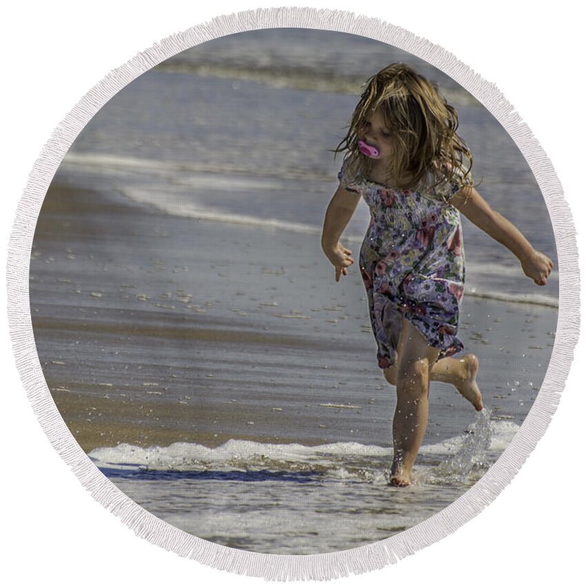 Dancing Round Beach Towel featuring the photograph Dancing in the surf with a pink pacifier by WAZgriffin Digital