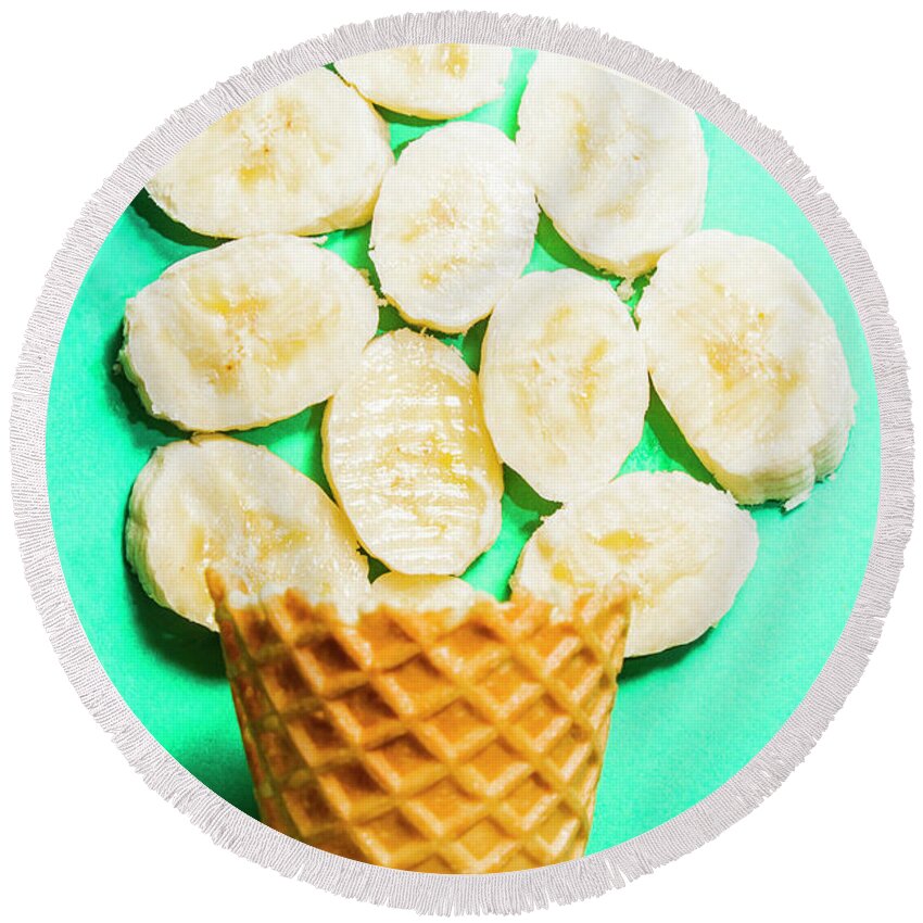 Banana Round Beach Towel featuring the photograph Dessert concept of ice-cream cone and banana slices by Jorgo Photography
