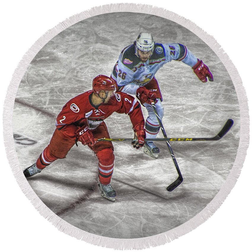 Ice Round Beach Towel featuring the photograph Hockey Players battling it out over the Puck by Randall Nyhof