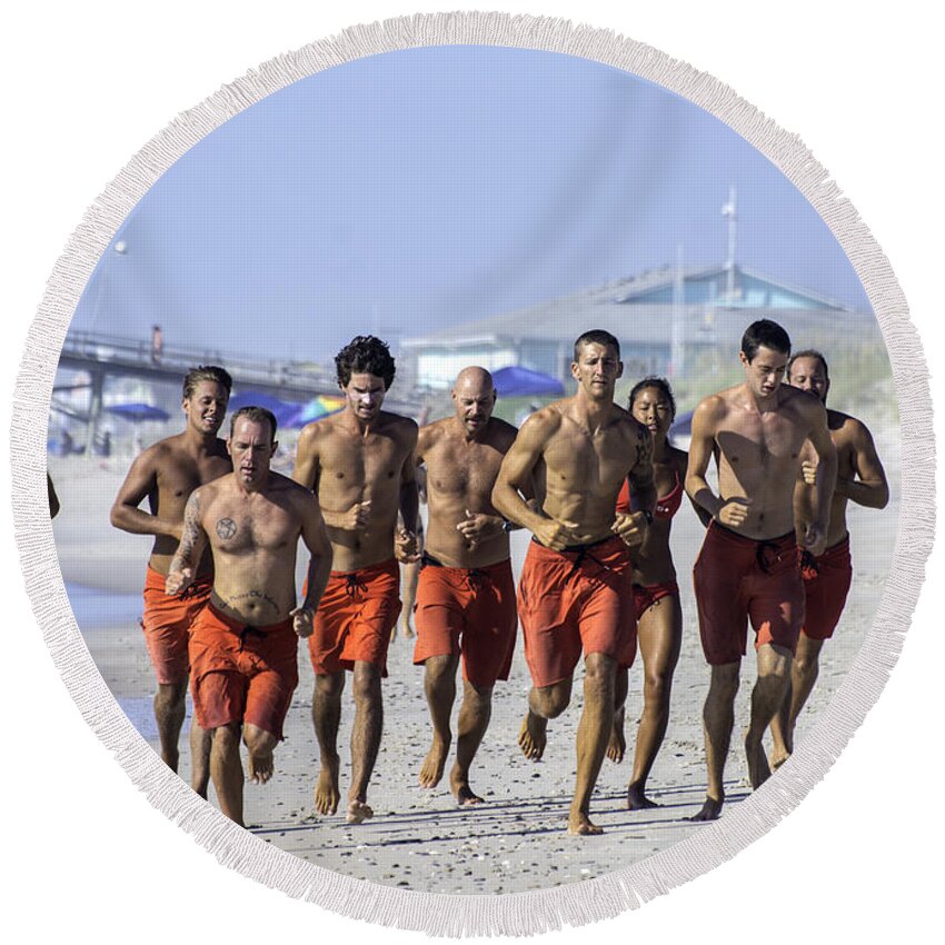  Life Guard Round Beach Towel featuring the photograph Kure Beach Life guards on the run by WAZgriffin Digital