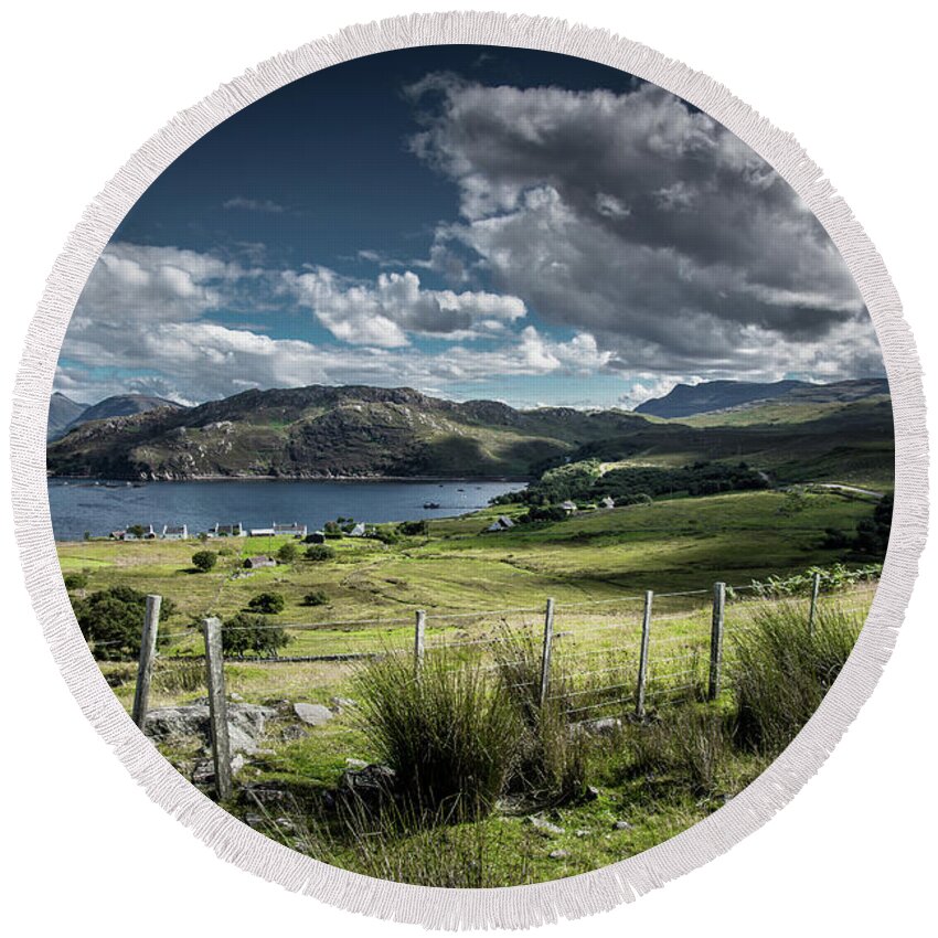 Scotland Round Beach Towel featuring the photograph Landscape with Remote Village at the Coast of the Isle of Skye in Scotland by Andreas Berthold