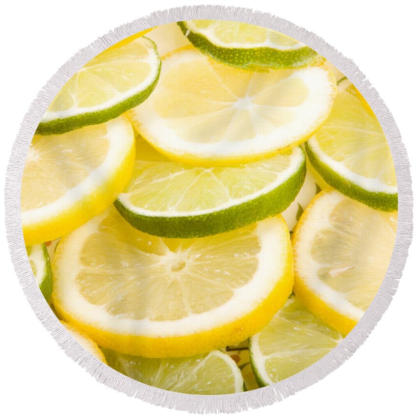 Lemons; Citrus; Citrus Fruit; Citrus Fruits; Close Up; Cross Section; Culinary; Food; Fruit; Fruits; Green; Key Lime; Key Limes; Lime; Limes; Slice; Sliced; Slices; Group; Sour Round Beach Towel featuring the photograph Lemons and Limes by James BO Insogna