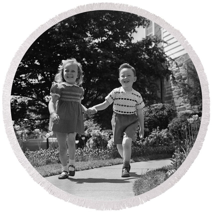 1950s Round Beach Towel featuring the photograph Little Boy And Girl Walking, Holding by H. Armstrong Roberts/ClassicStock