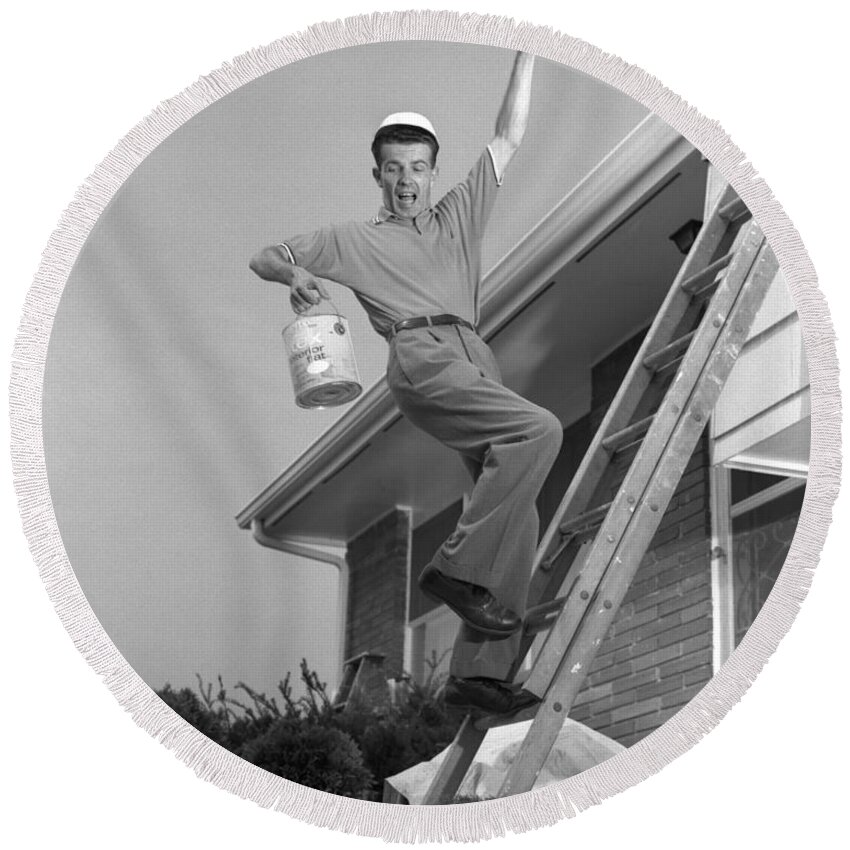 1960s Round Beach Towel featuring the photograph Man Falling Off Ladder by H. Armstrong Roberts/ClassicStock