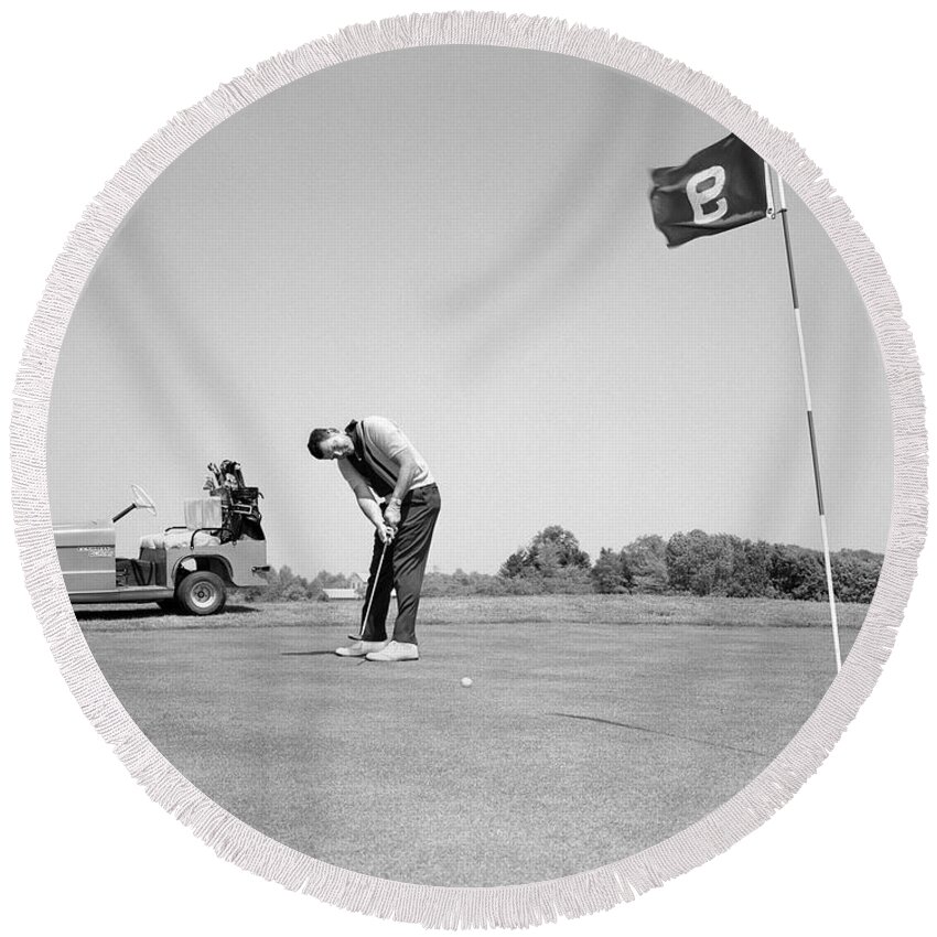 1960s Round Beach Towel featuring the photograph Man Golfing, C.1960s by H. Armstrong Roberts/ClassicStock