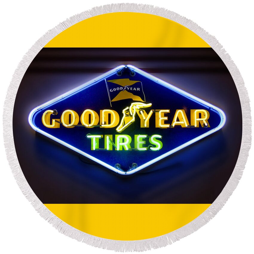 Transportation Round Beach Towel featuring the photograph Neon Goodyear Tires Sign by Mike McGlothlen