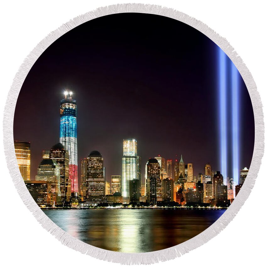 New York City Skyline At Night Round Beach Towel featuring the photograph New York City Skyline Tribute in Lights and Lower Manhattan at Night NYC by Jon Holiday