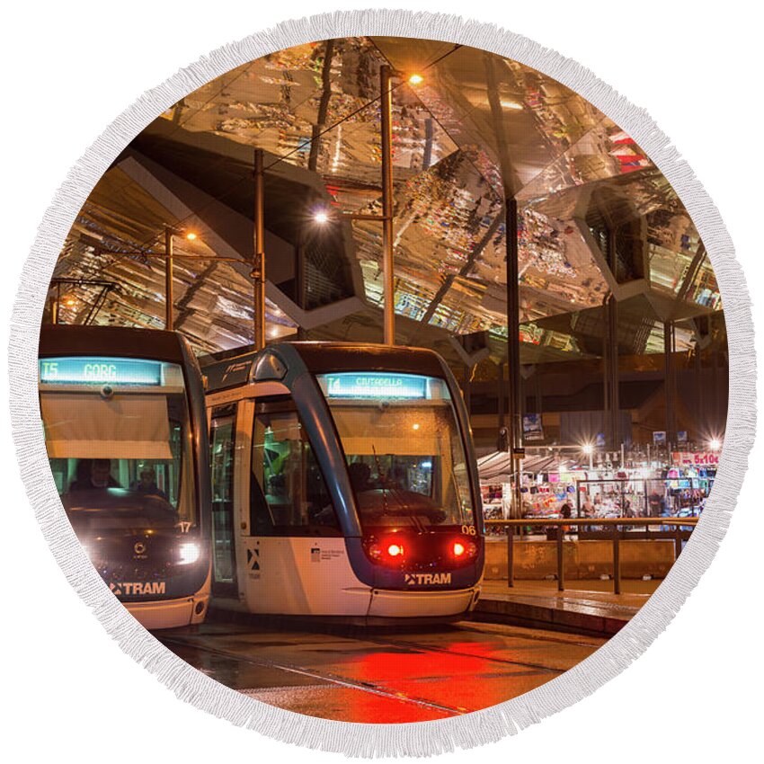 Glories Round Beach Towel featuring the photograph Night view of two trams at Glories station by Andrew Michael