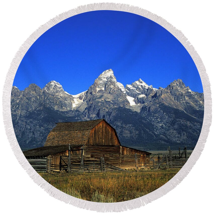 Late Snow Round Beach Towel featuring the photograph North Moulton barn Grand Tetons by Gary Langley