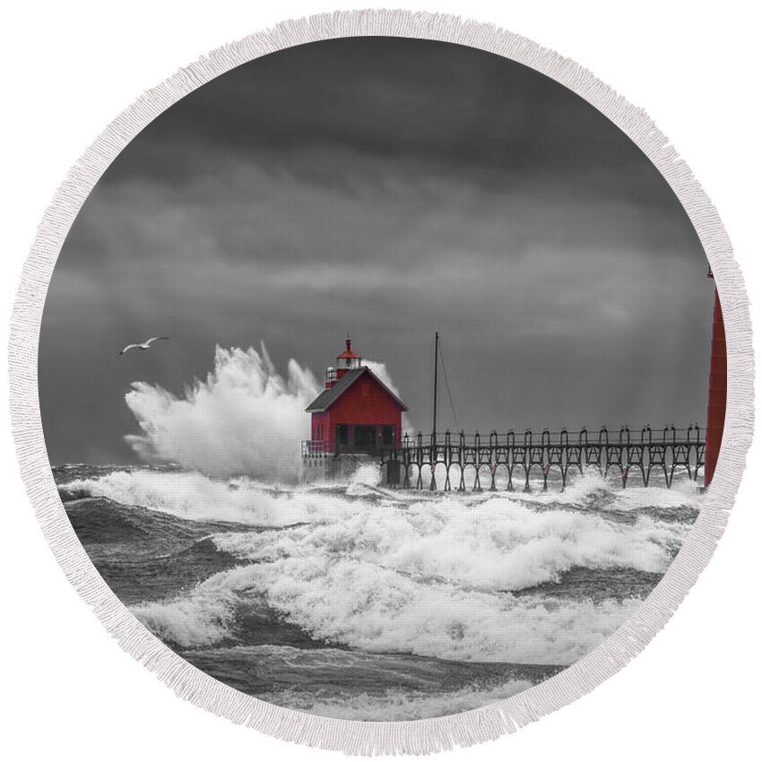 Lighthouse Round Beach Towel featuring the photograph November Storm with Flying Gull by the Grand Haven Lighthouse by Randall Nyhof