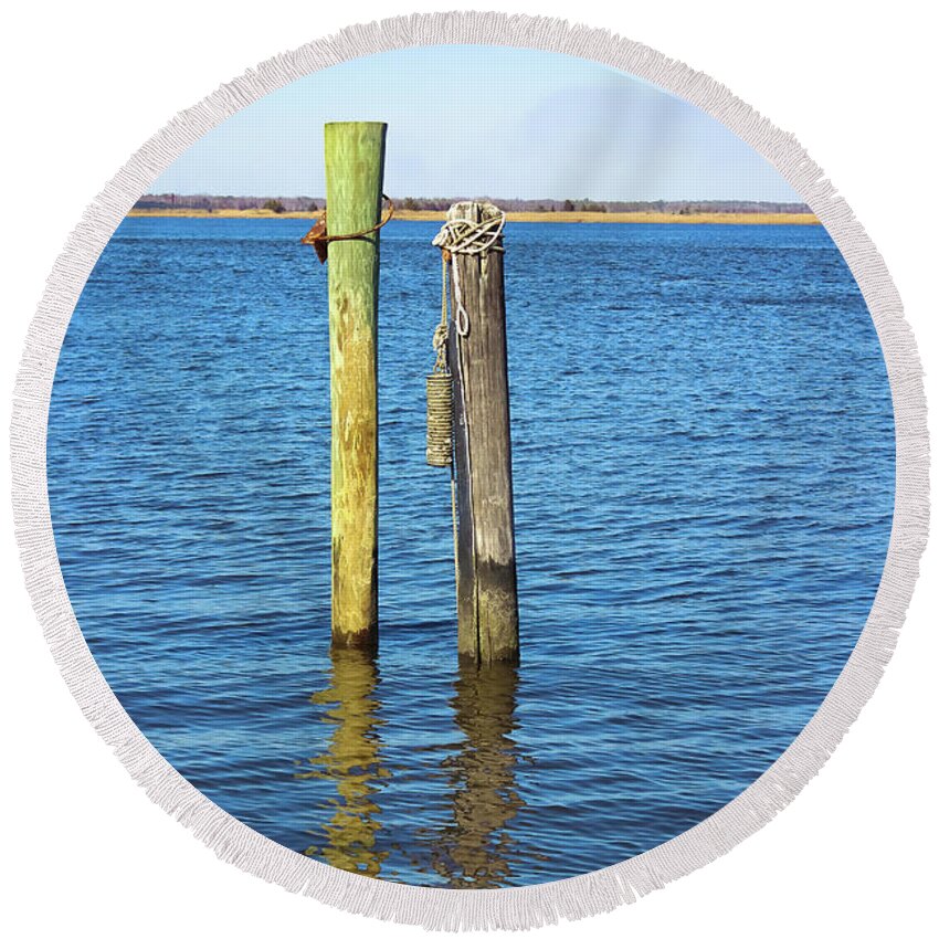 Wood Pilings Round Beach Towel featuring the photograph Old Wood Pilings in Blue Water by Colleen Kammerer