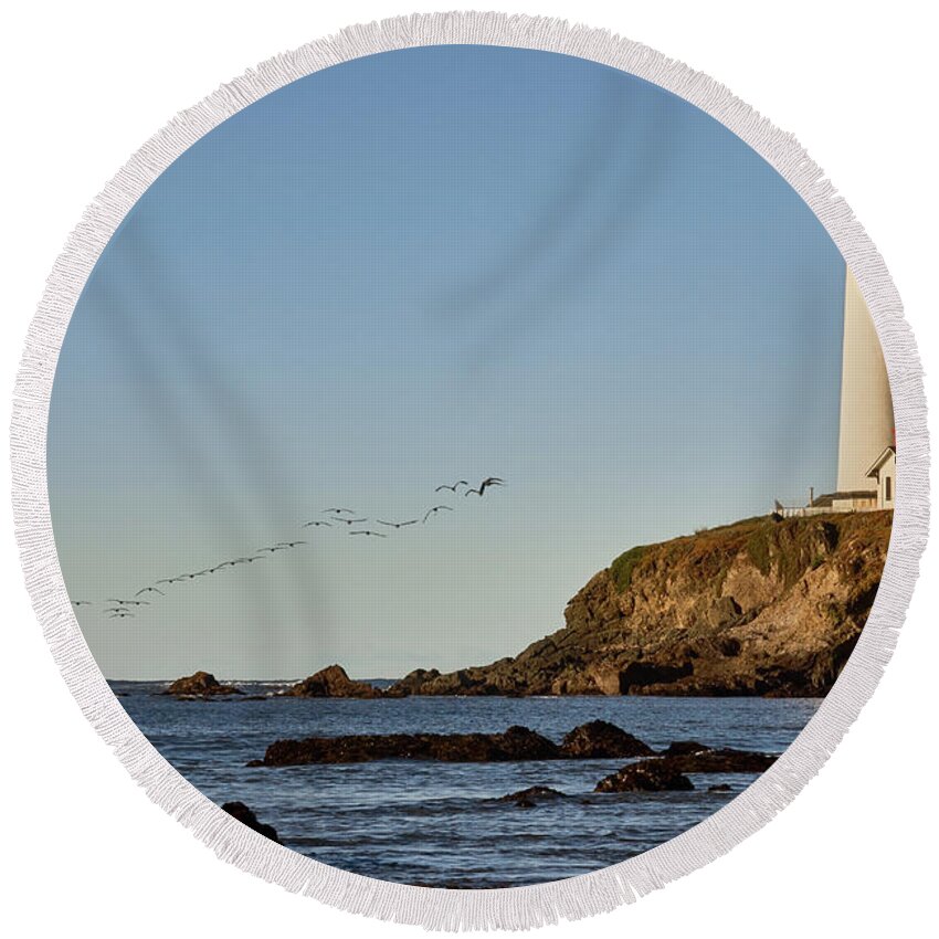 Architecture Round Beach Towel featuring the photograph Pigeon Point Light House with Pelican Flight by Dean Birinyi