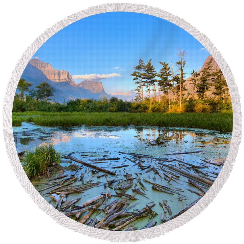 St Mary Lake Round Beach Towel featuring the photograph Pink Peaks Over Driftwood by Adam Jewell