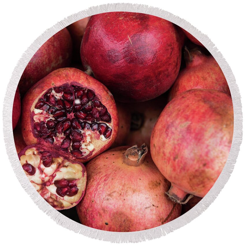 Pomegranate Round Beach Towel featuring the photograph Red fresh Pomegranate fruits by Michalakis Ppalis