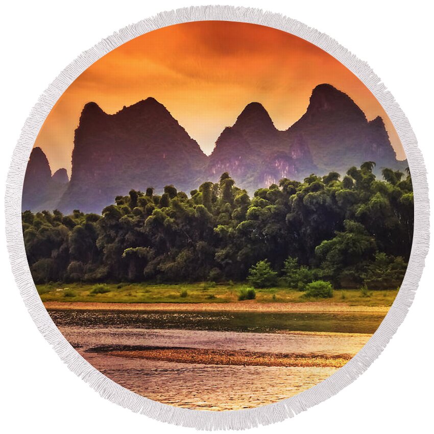 Sunset Round Beach Towel featuring the photograph Red sunset glows-China Guilin scenery Lijiang River in Yangshuo by Artto Pan