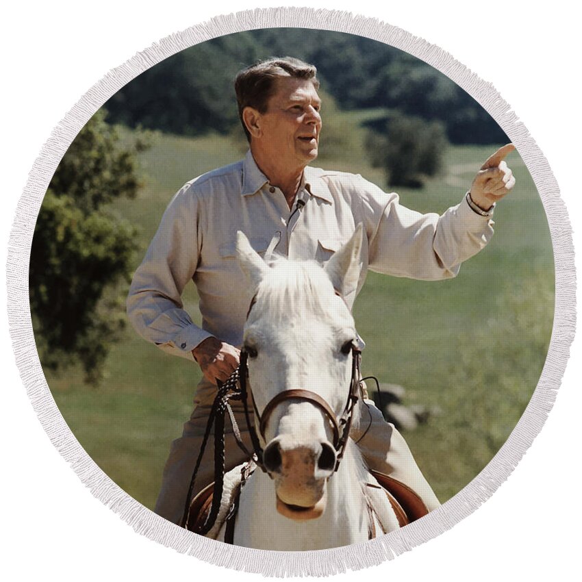 Ronald Reagan Round Beach Towel featuring the photograph Ronald Reagan On Horseback by War Is Hell Store