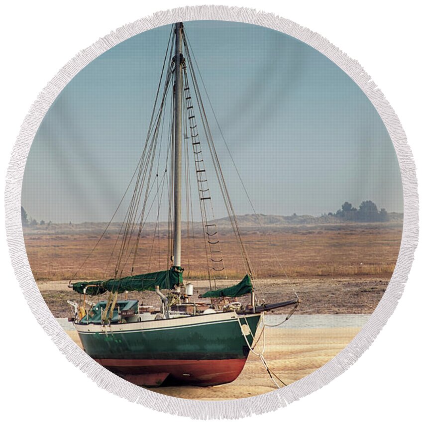 Wells Round Beach Towel featuring the photograph Norfolk sail boat stranded at low tide by Simon Bratt