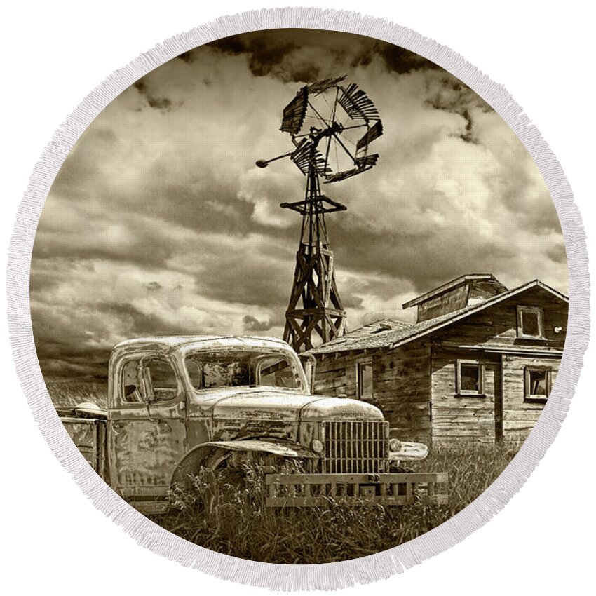 Landscape Round Beach Towel featuring the photograph Sepia Tone of Old Vintage Junk Dodge Pickup and Decaying Barn with Windmill by Randall Nyhof