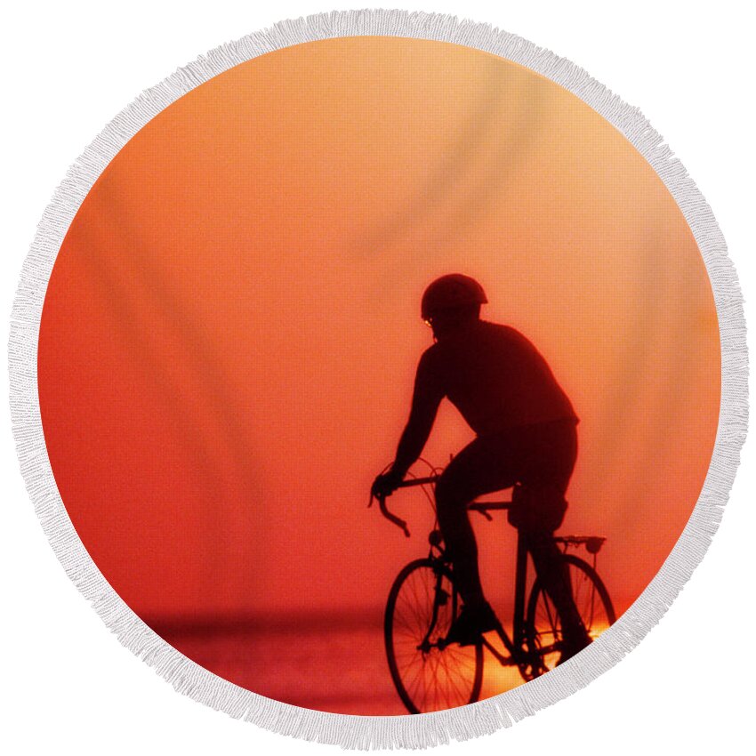 Silhouetted Round Beach Towel featuring the photograph Silhouetted Bike Rider Sunrise Chicago Lake Front by Tom Jelen