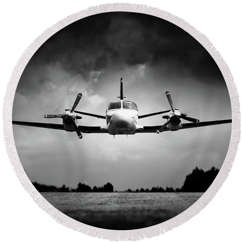 Airplane Round Beach Towel featuring the photograph Small airplane low flyby by Johan Swanepoel