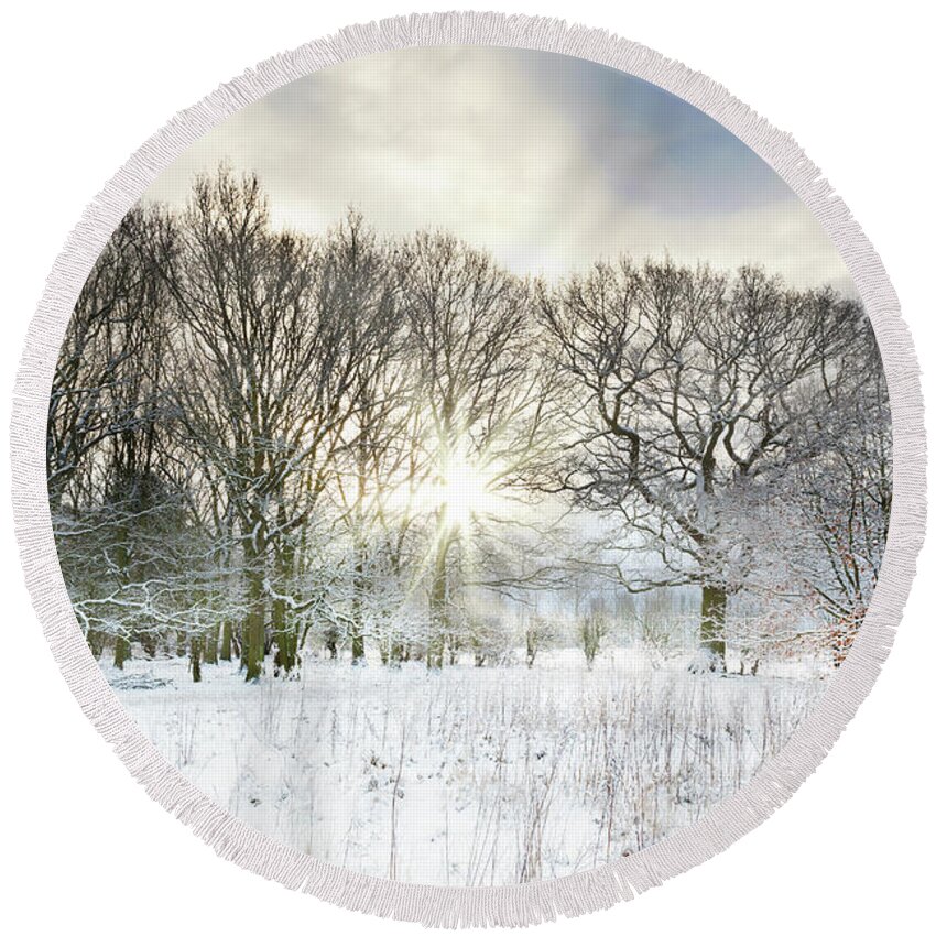 Snow Round Beach Towel featuring the photograph Snow covered rural trees with early morning sunrise by Simon Bratt