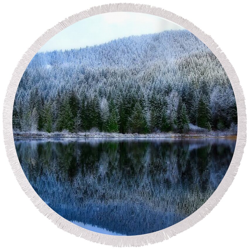 Snow Covered Trees Reflections Round Beach Towel featuring the photograph Snow covered trees reflections by Lynn Hopwood