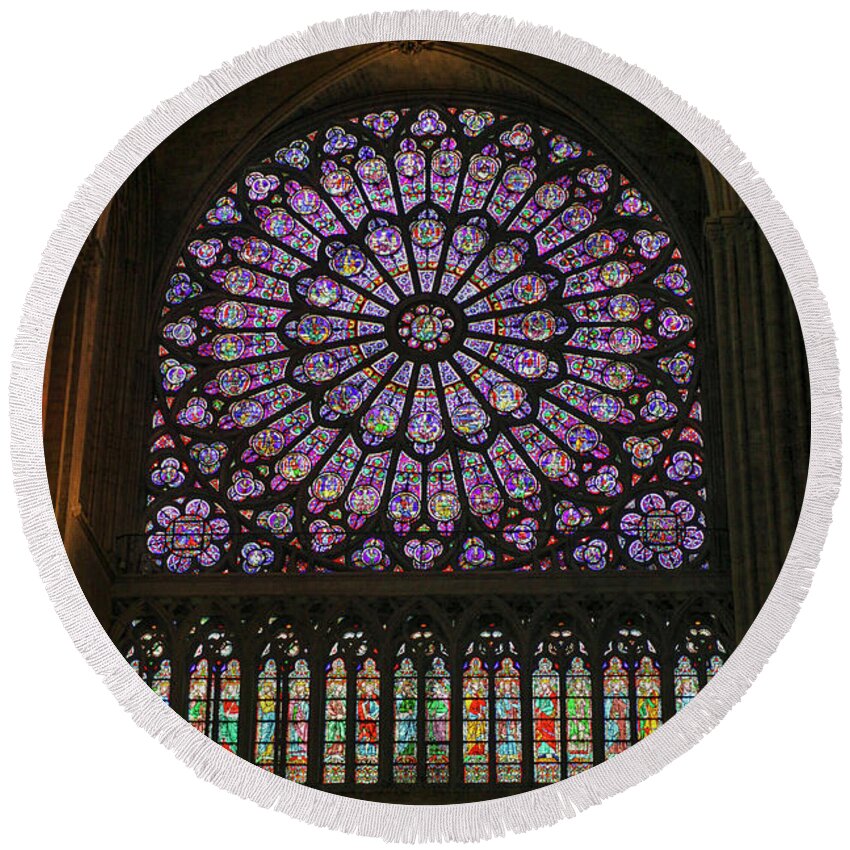 Antique Round Beach Towel featuring the photograph Stained glass window of the Notre Dame by Patricia Hofmeester